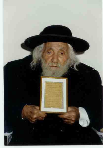 Saba In Black Holding Framed Petek